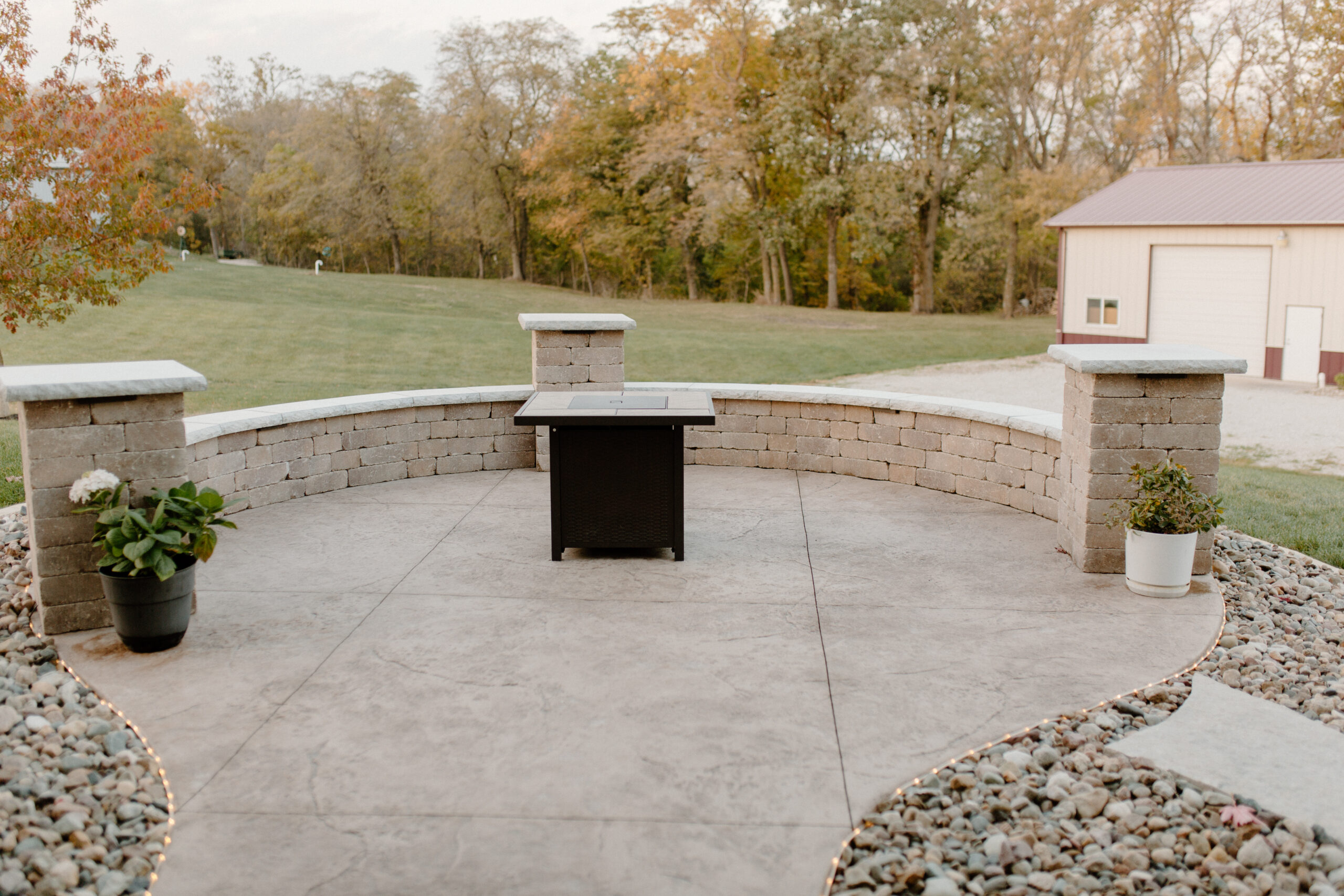 Final product with firepit with seating surround. Creative Nature Des Moines