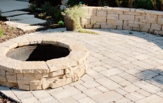 Firepit and surrounding seating made from stone - hardscaping from Creative Nature